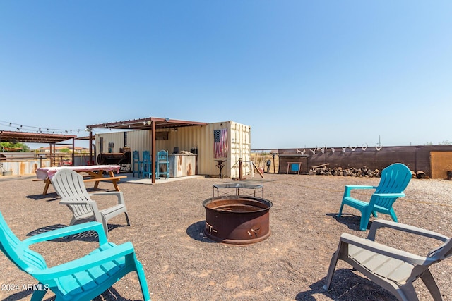 view of patio / terrace with an outdoor fire pit