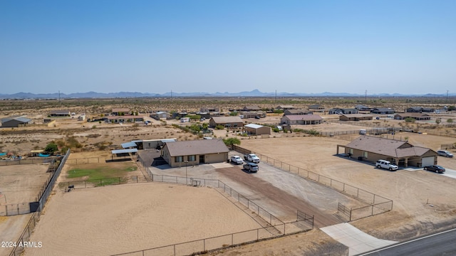 birds eye view of property featuring a mountain view and a desert view