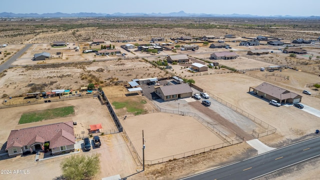 birds eye view of property featuring a mountain view and a desert view