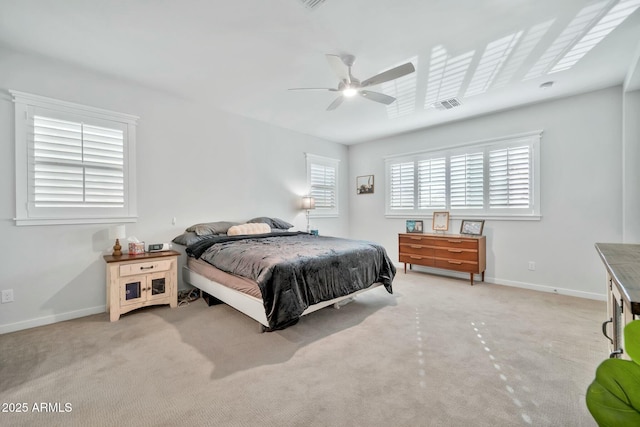 bedroom with ceiling fan and light colored carpet