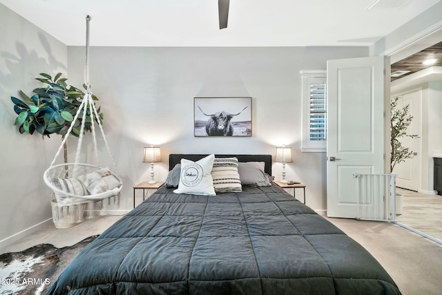 carpeted bedroom featuring ceiling fan