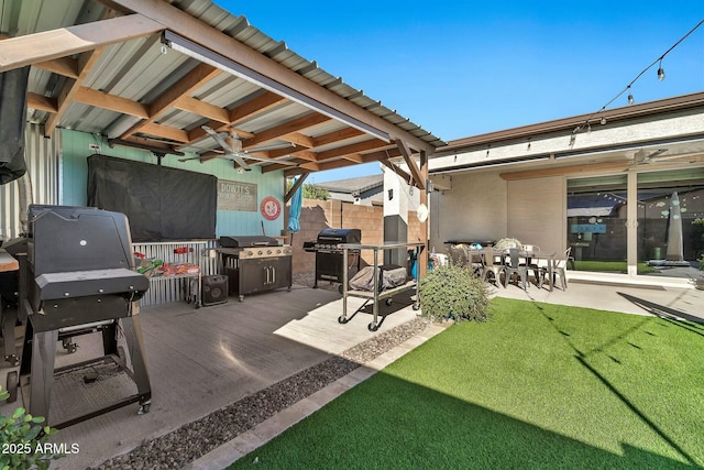 view of patio featuring ceiling fan and a grill