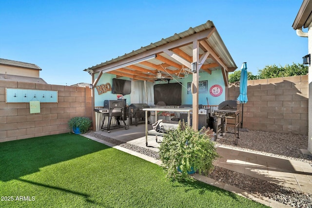 view of patio / terrace featuring ceiling fan and a bar