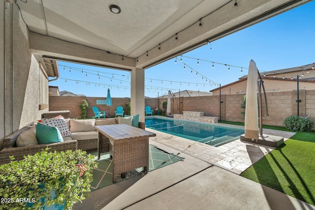 view of pool featuring outdoor lounge area and a patio