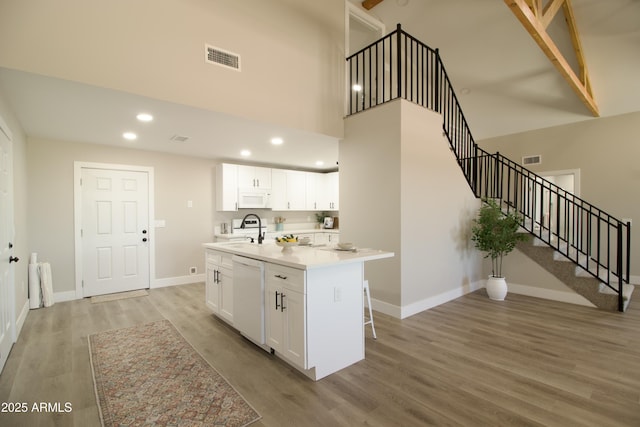 2573 E Superstition Blvd, Apache Junction, AZ 85119 - kitchen featuring white appliances, a sink, baseboards, white cabinets, and recessed lighting