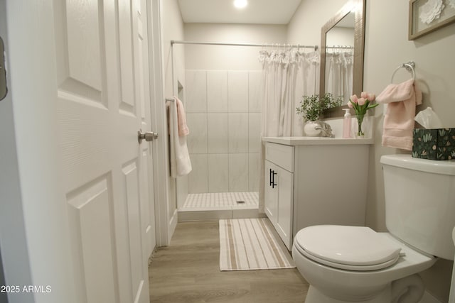 2573 E Superstition Blvd, Apache Junction, AZ 85119 - bathroom featuring wood finished floors, tiled shower, toilet, vanity, and recessed lighting