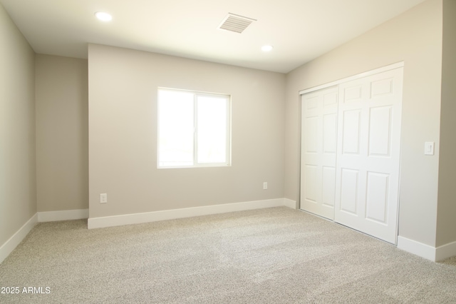 2573 E Superstition Blvd, Apache Junction, AZ 85119 - unfurnished bedroom with carpet, baseboards, a closet, and recessed lighting