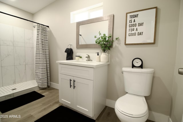 2573 E Superstition Blvd, Apache Junction, AZ 85119 - full bathroom featuring toilet, vanity, baseboards, and a tile shower