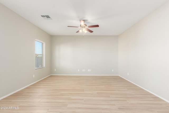 empty room with light wood-type flooring and ceiling fan