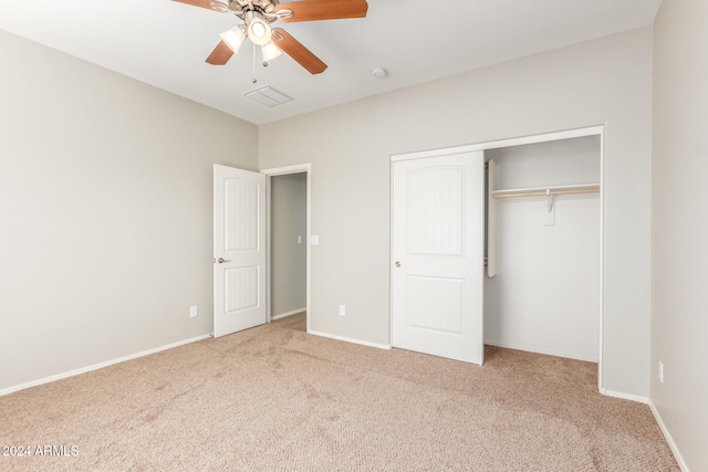 unfurnished bedroom with carpet, ceiling fan, and a closet