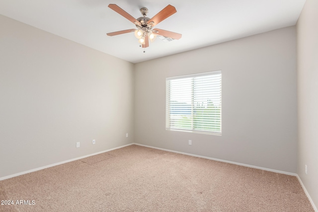 unfurnished room featuring ceiling fan and carpet floors