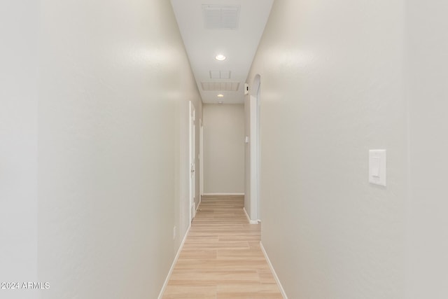 hall with light hardwood / wood-style flooring