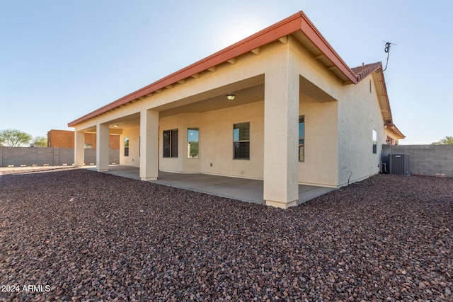 back of house with a patio and central AC