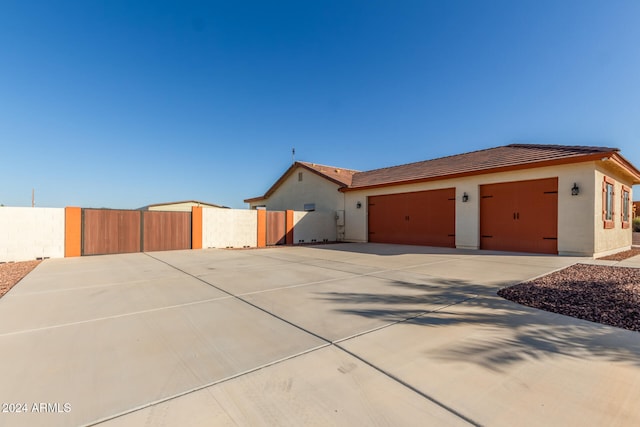 view of side of property featuring a garage