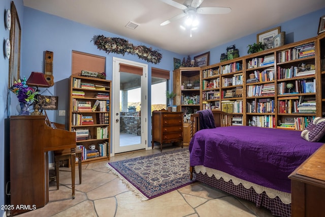 bedroom featuring ceiling fan and access to exterior