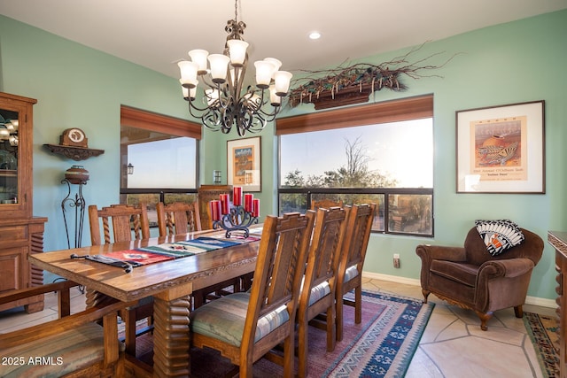 tiled dining area with a chandelier