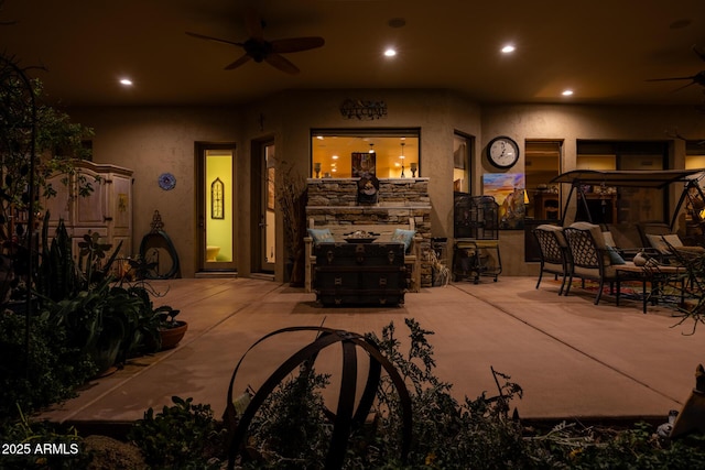 patio at night with ceiling fan