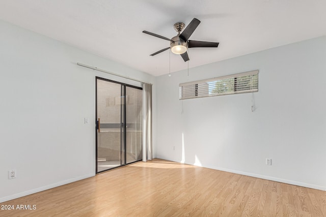 empty room featuring ceiling fan and light hardwood / wood-style flooring