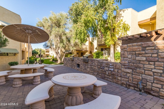 view of patio / terrace with area for grilling and a grill