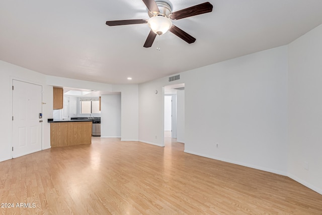 unfurnished living room with light hardwood / wood-style floors and ceiling fan