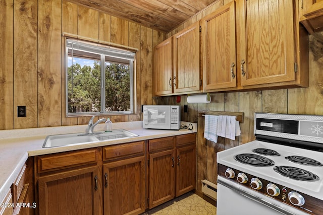 kitchen with wooden walls, white appliances, wood ceiling, sink, and a baseboard radiator