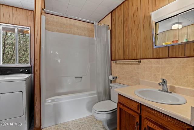 full bathroom featuring vanity, tasteful backsplash, washer / dryer, toilet, and shower / bathtub combination with curtain