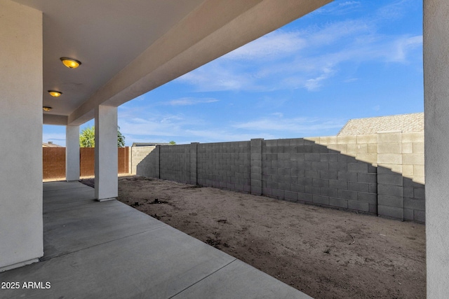 view of yard with a patio and a fenced backyard