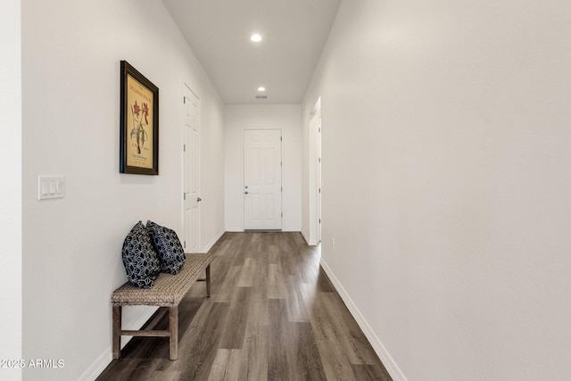 corridor with visible vents, recessed lighting, wood finished floors, and baseboards