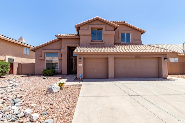 7179 W Surrey Ave, Peoria, AZ 85381 - view of front of home featuring driveway, stucco siding, an attached garage, a tile roof, and fence