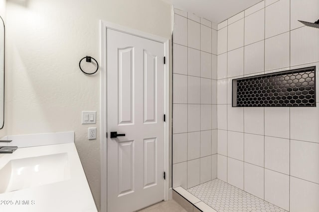 7179 W Surrey Ave, Peoria, AZ 85381 - bathroom with tiled shower and a sink