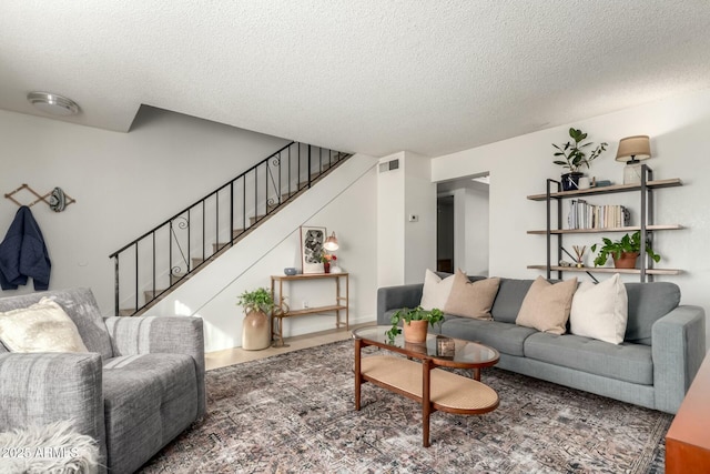 living room with a textured ceiling