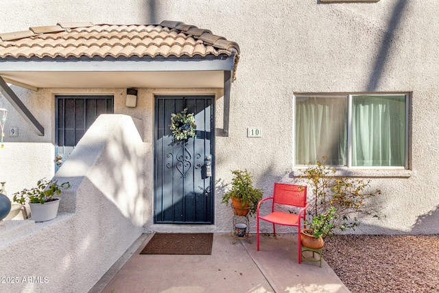 property entrance with a patio