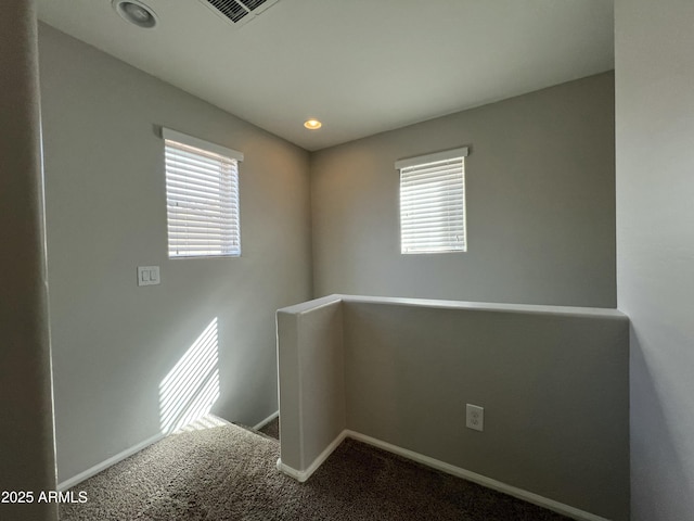 unfurnished room featuring recessed lighting, carpet, visible vents, and baseboards