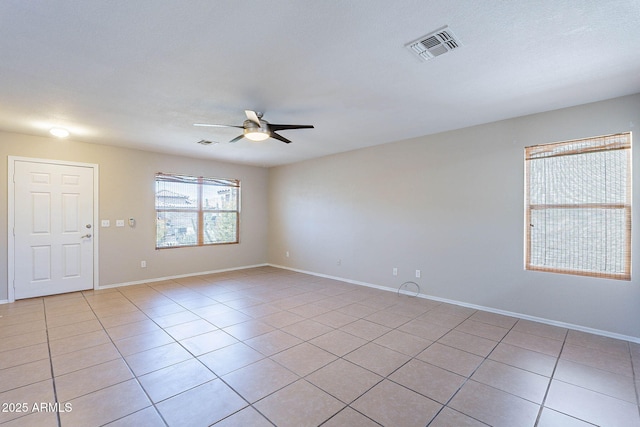 645 W Kingman Loop, Casa Grande, AZ 85122 - empty room featuring a ceiling fan, light tile patterned flooring, and baseboards