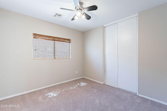 645 W Kingman Loop, Casa Grande, AZ 85122 - unfurnished bedroom featuring carpet floors, a closet, baseboards, and ceiling fan