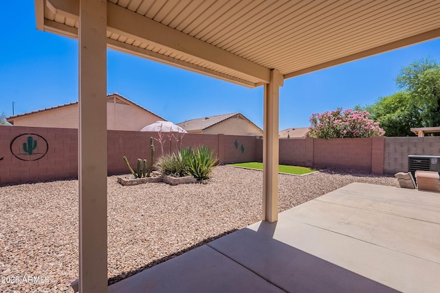 645 W Kingman Loop, Casa Grande, AZ 85122 - fenced backyard with a patio area