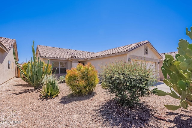 645 W Kingman Loop, Casa Grande, AZ 85122 - view of home's exterior featuring a tiled roof and stucco siding