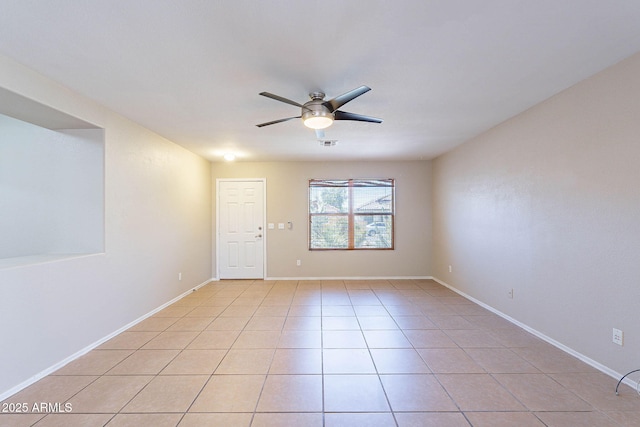 645 W Kingman Loop, Casa Grande, AZ 85122 - spare room with a ceiling fan, light tile patterned flooring, and baseboards