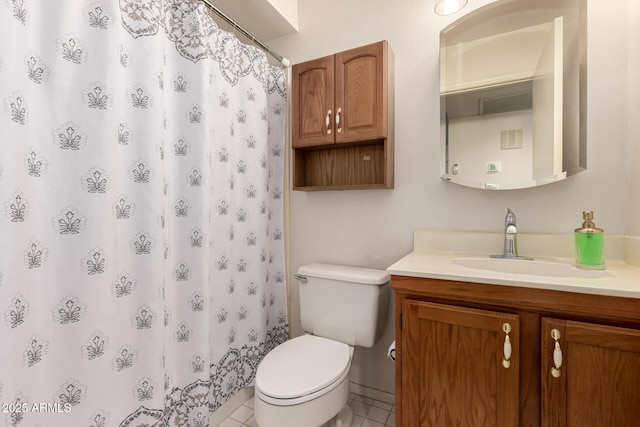 bathroom featuring tile patterned floors, curtained shower, vanity, and toilet