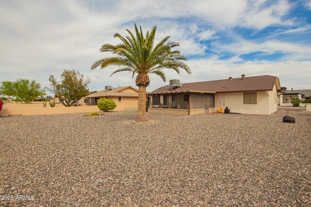 exterior space featuring stucco siding and a sunroom
