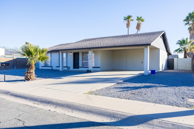 ranch-style home with a carport