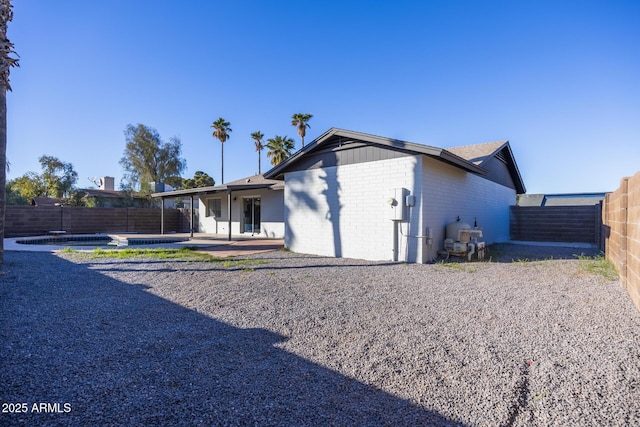 rear view of house featuring a patio area