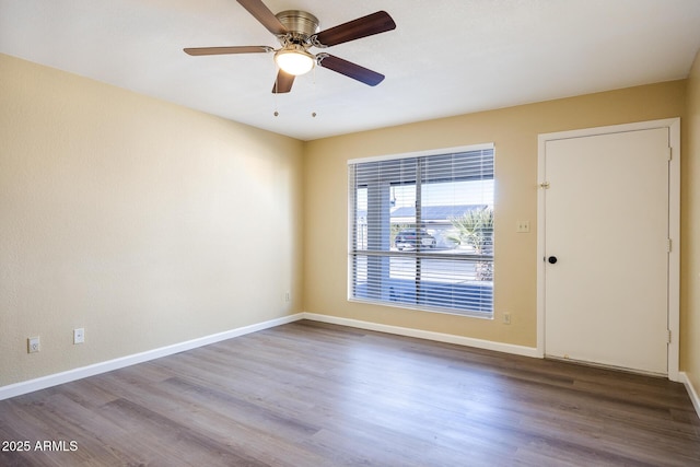 unfurnished room with wood-type flooring and ceiling fan