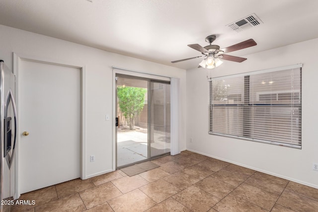 6085 S Wilson Dr, Chandler, AZ 85249 - spare room featuring a ceiling fan and baseboards
