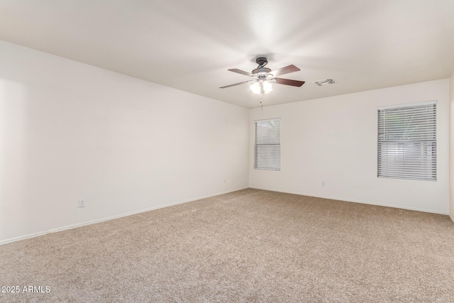 6085 S Wilson Dr, Chandler, AZ 85249 - empty room featuring carpet, ceiling fan, and baseboards