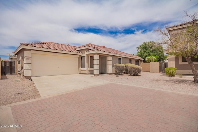6085 S Wilson Dr, Chandler, AZ 85249 - mediterranean / spanish-style home featuring concrete driveway, a gate, an attached garage, and stucco siding
