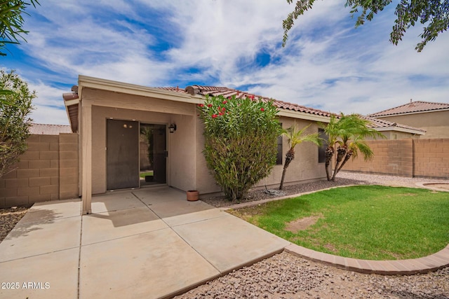 6085 S Wilson Dr, Chandler, AZ 85249 - view of front facade featuring stucco siding, a patio area, and a tiled roof