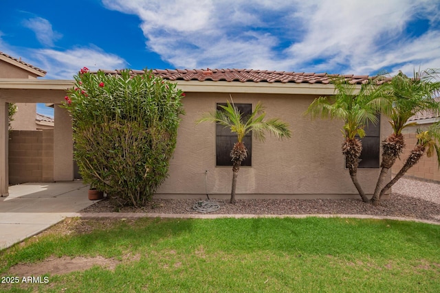 6085 S Wilson Dr, Chandler, AZ 85249 - view of property exterior with stucco siding and a tile roof