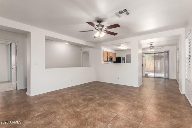 6085 S Wilson Dr, Chandler, AZ 85249 - unfurnished living room featuring ceiling fan, baseboards, and tile patterned flooring