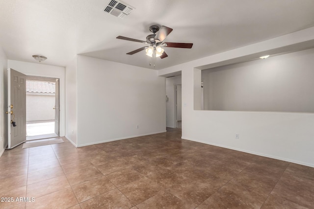 6085 S Wilson Dr, Chandler, AZ 85249 - spare room with ceiling fan and baseboards